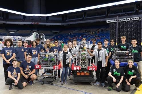 Members of the Seven Lakes RoboSpartans (left), the Tompkins Steel Talons (center) and the Cinco Ranch Team 624 CRyptonite teams pose with their projects they competed with at the 2021 UIL Robotics State Championship in late June. All three teams did well, but Team 624 CRyptonite pulled the most awards, placing in three categories.